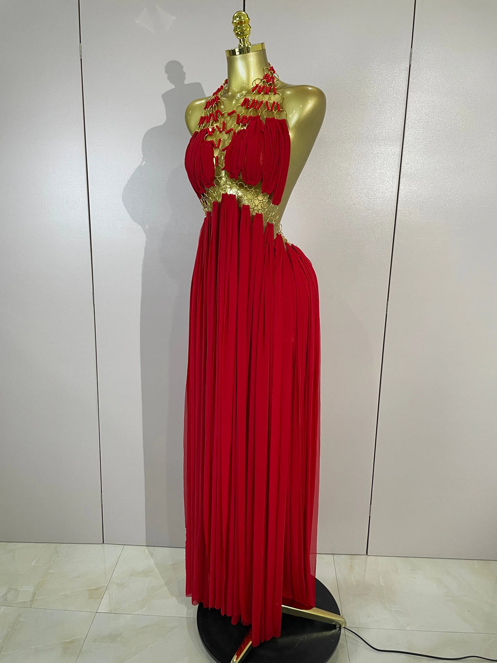 Red halter neck maxi dress with gold trim