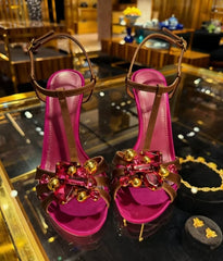 Pair of crystal embellished t-strap stiletto heels displayed