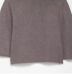 Close-up of a textured brown fabric on a white background