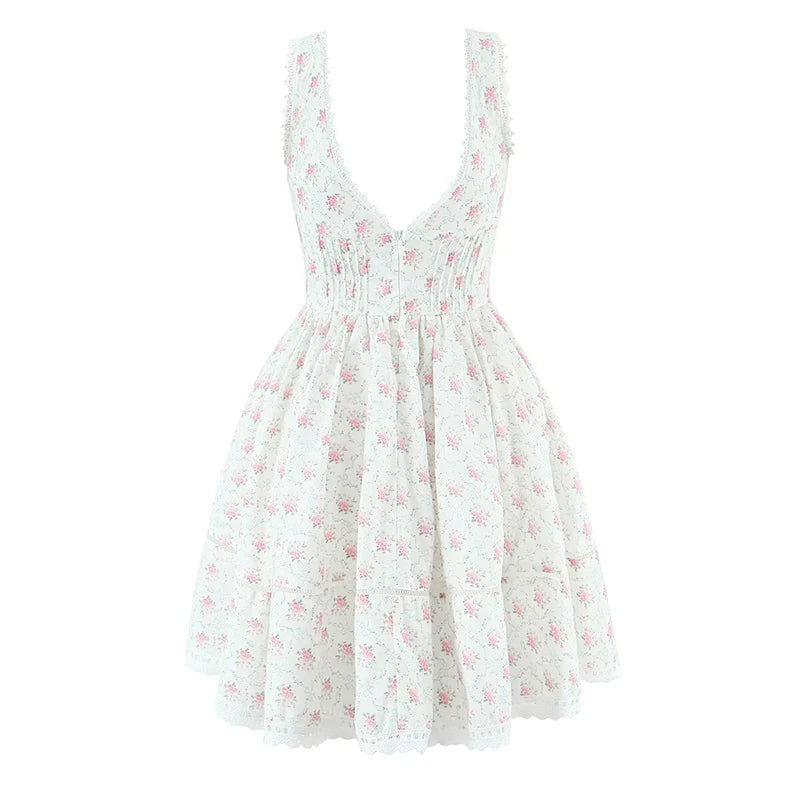 White dress with pink floral pattern on a white background