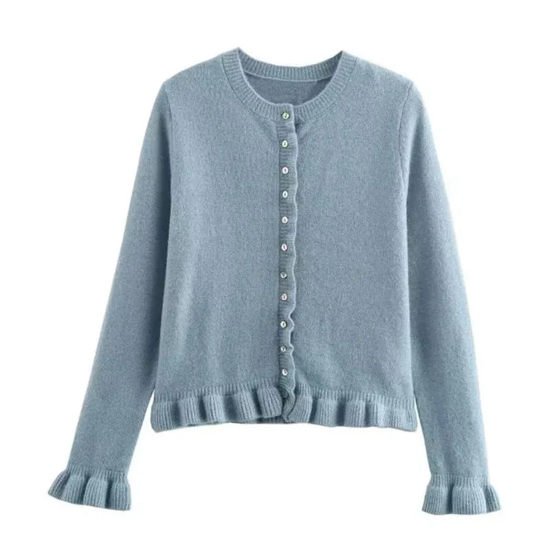 Light blue cardigan with buttons on a white background