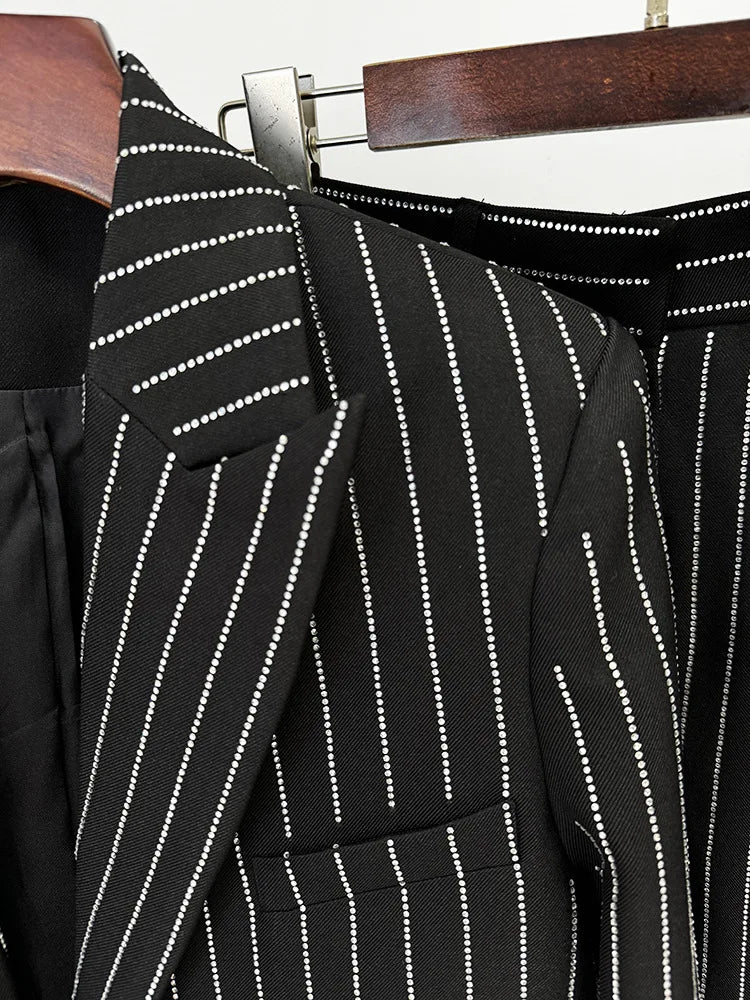 Black pinstripe suit jacket on a hanger