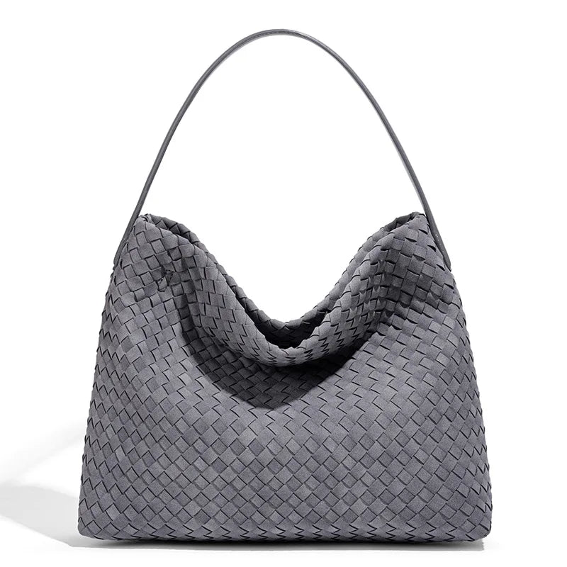 Gray woven handbag on a white background