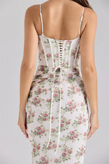 Floral dress with lace-up back on a plain background