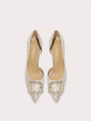 Pair of embellished pointed-toe shoes on a light gray background