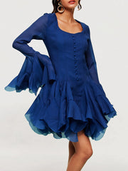 Blue dress with ruffled layers on a white background