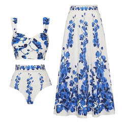 White and blue floral print sweetheart neckline bikini top with high-waisted bottoms and matching maxi skirt