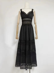Black lace dress on a mannequin against a white background