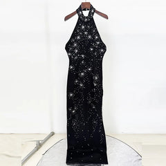 Black halter neck dress with star pattern on a white background