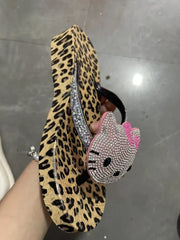 Leopard print flip flop with a pink bow and Hello Kitty rhinestone design