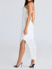White dress worn by a model on a light gray background