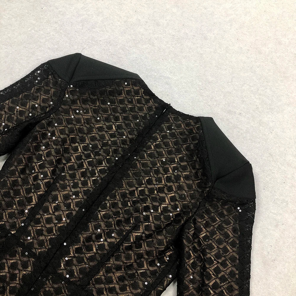 Black sequined jacket on a textured white background