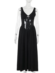 Black sleeveless dress on a mannequin against a white background