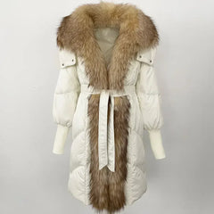 White puffer coat with fur trim on a light gray background