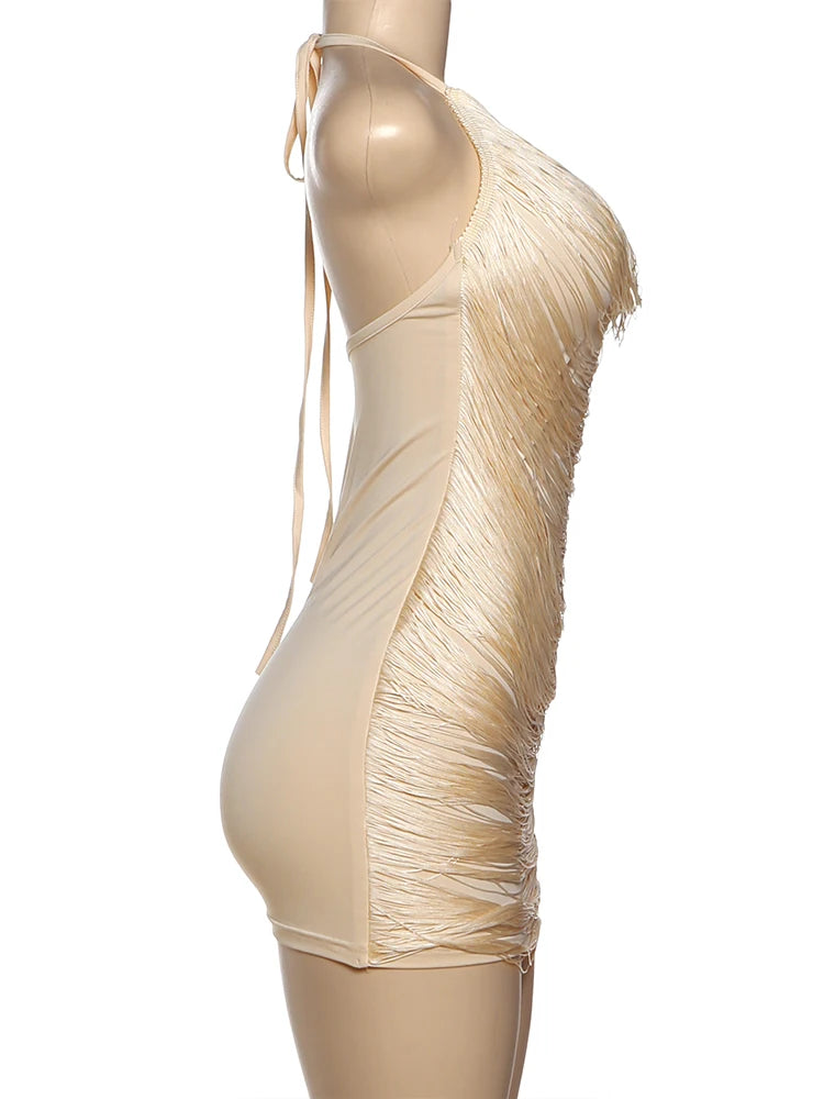 Beige fringe dress on a mannequin against a white background