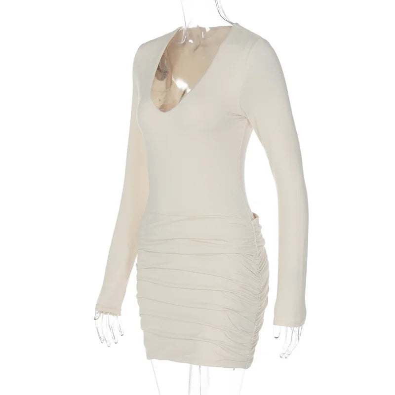 Beige long-sleeve dress on a mannequin against a white background