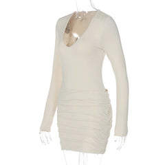 Beige long-sleeve dress on a mannequin against a white background