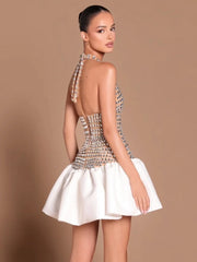 Crystal embellished halter neck mini dress with white voluminous skirt, back view