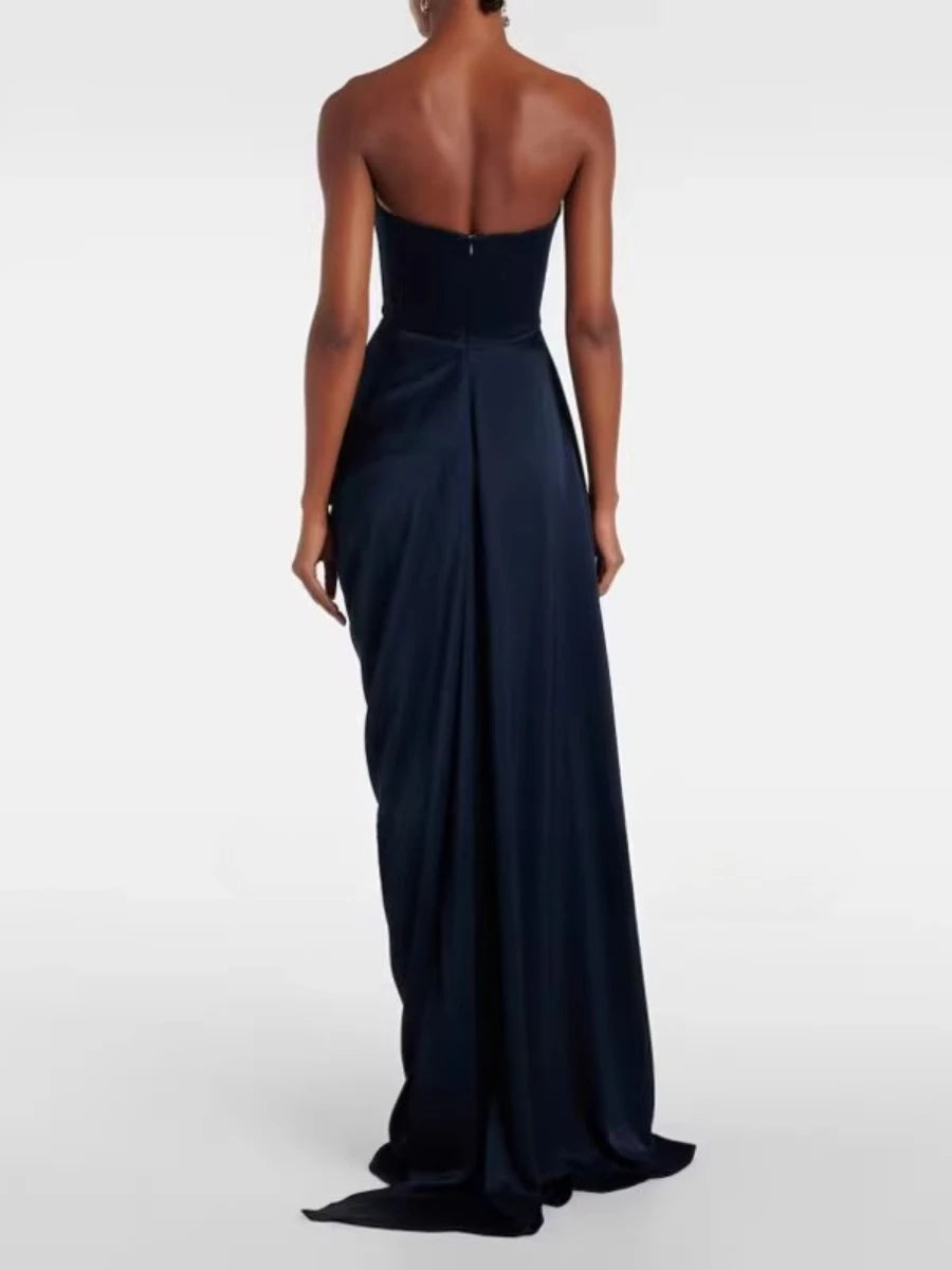 Navy strapless gown on a white background