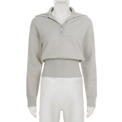 Close-up of knit polo collar showing textured ribbing and relaxed buttonless placket