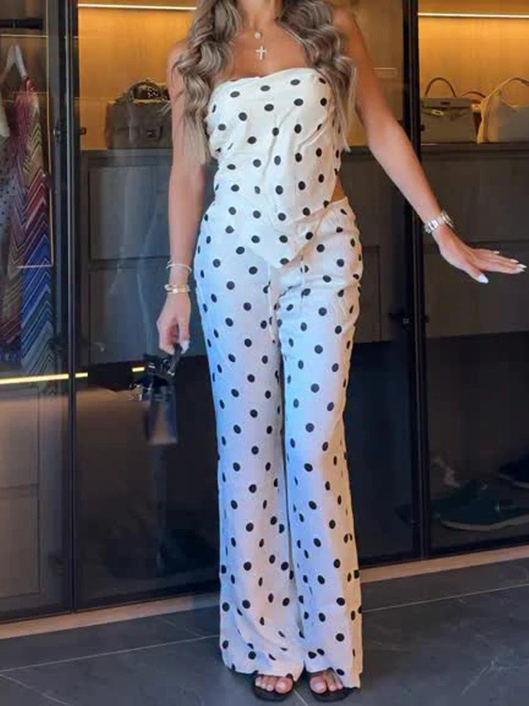 Model wearing white polka dot tube top and wide leg pants