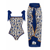 Floral print bikini set with tie straps and a matching wrap sarong.