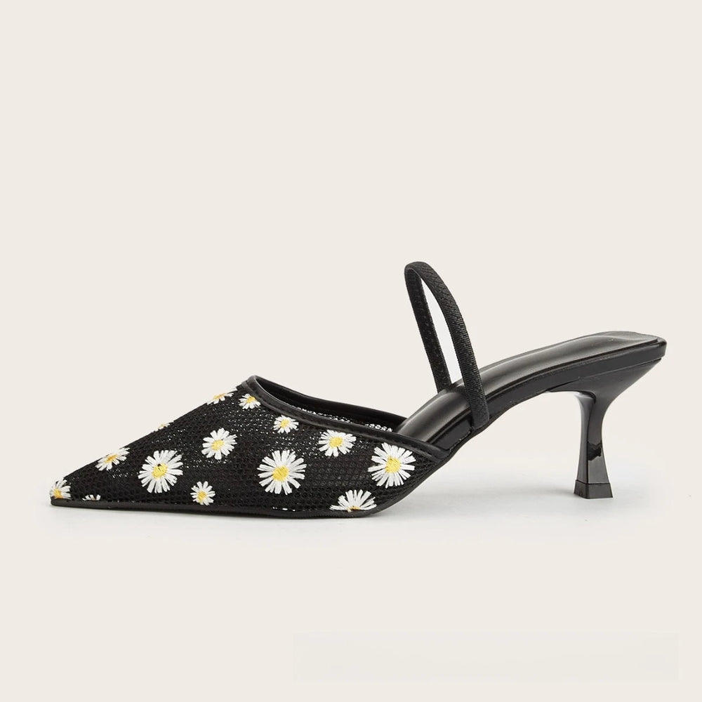 Side view of black daisy embroidered mesh slingback heels