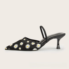 Side view of black daisy embroidered mesh slingback heels