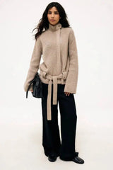 Ribbed knit belted turtleneck coat worn by model