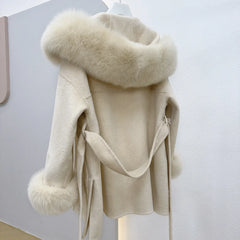Beige coat with fur collar on a white background