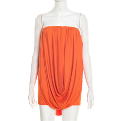 Orange dress on a mannequin against a white background