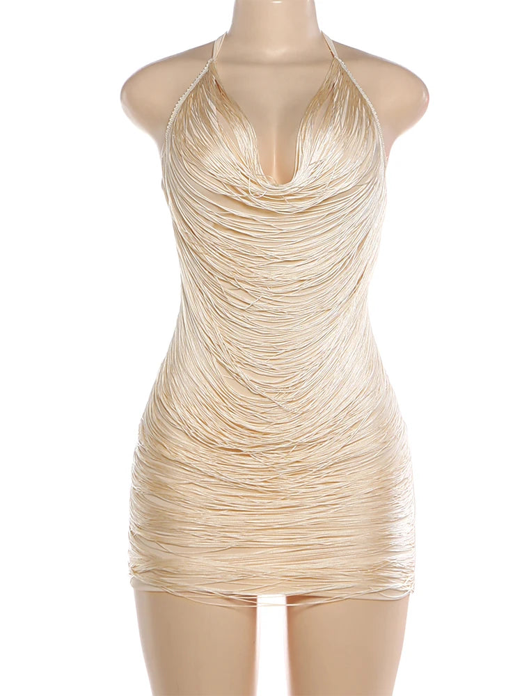 Beige halter neck dress on a mannequin against a white background