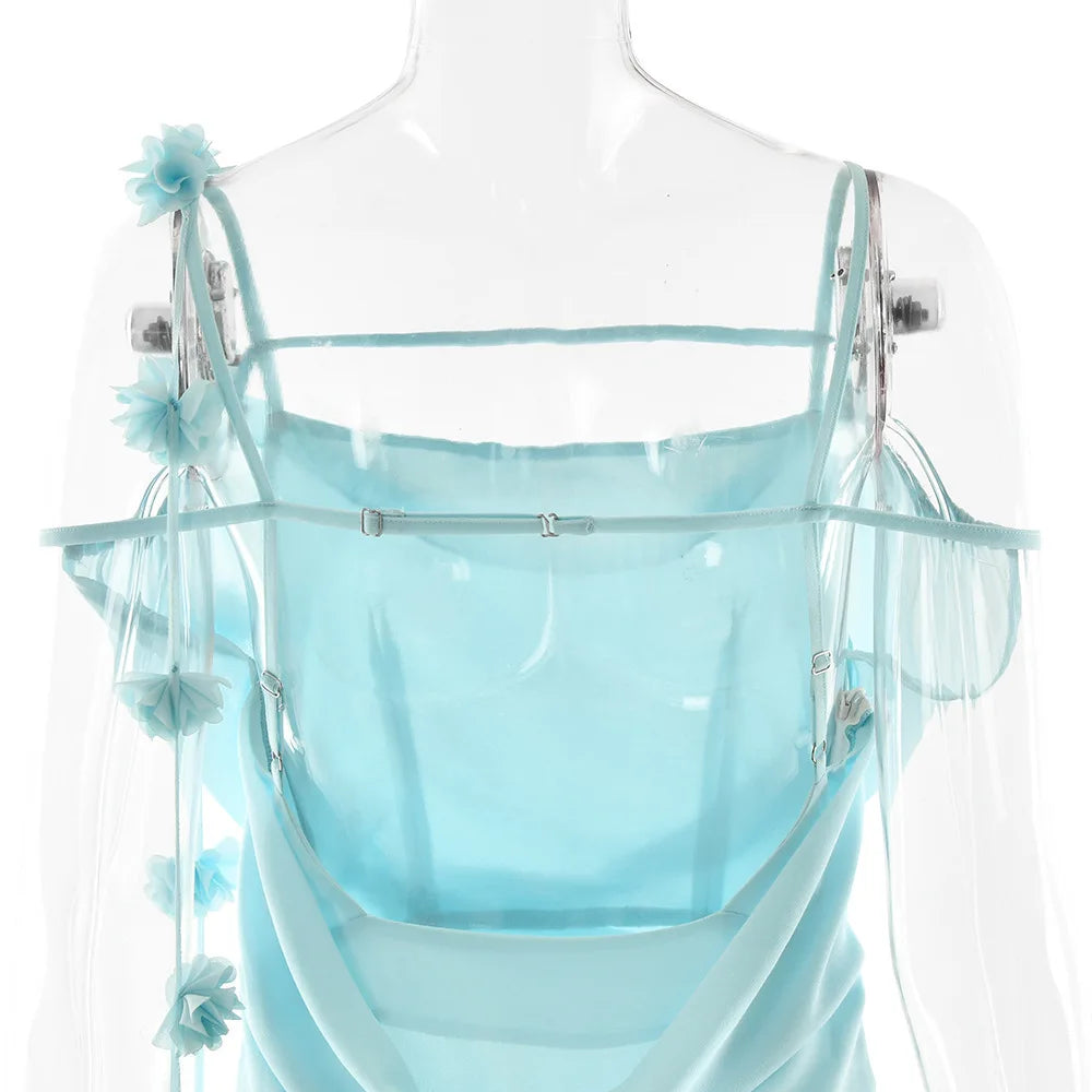 Light blue dress with floral straps on a mannequin against a white background