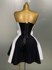 Black and white dress on a mannequin against a plain background