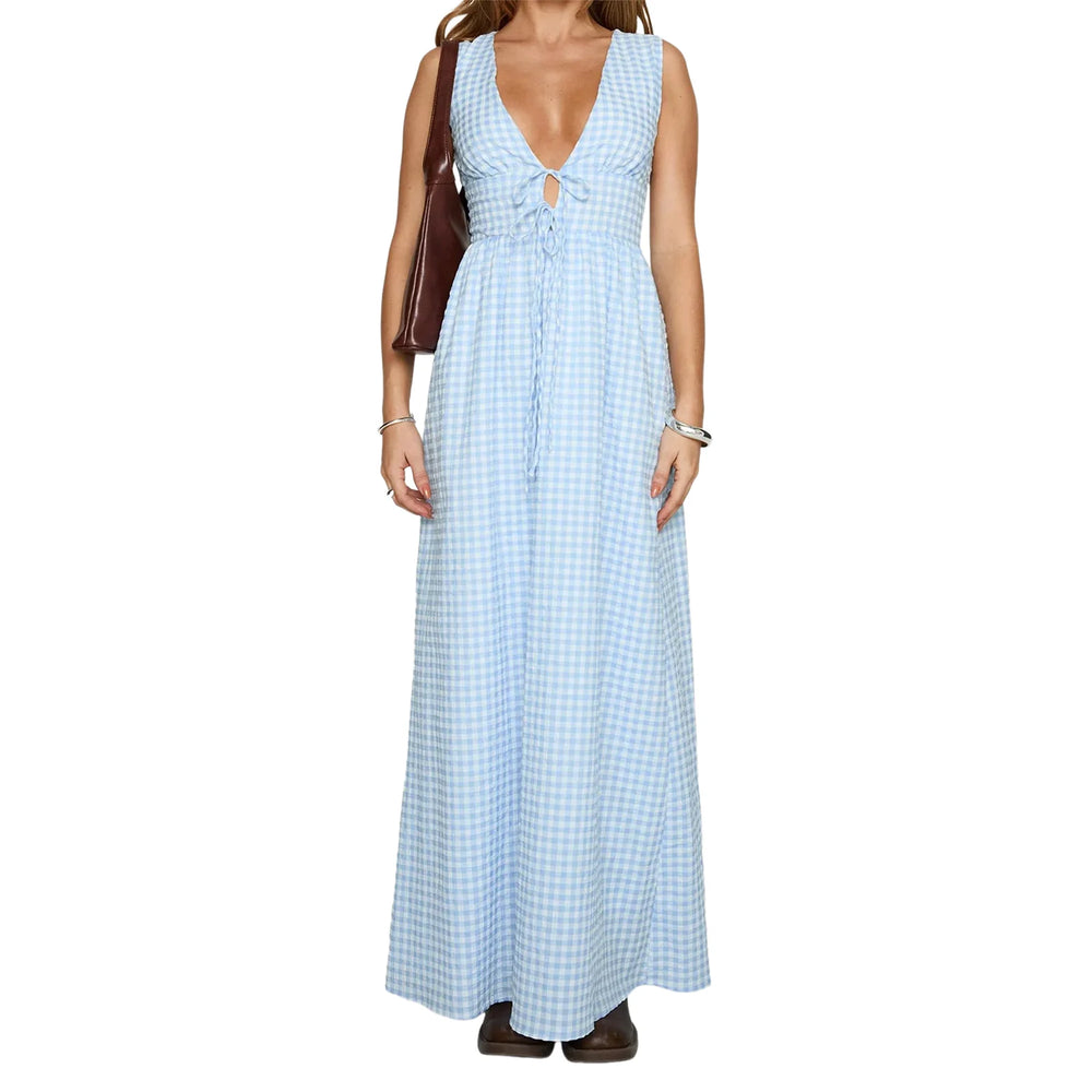 Woman wearing a blue checkered dress on a white background