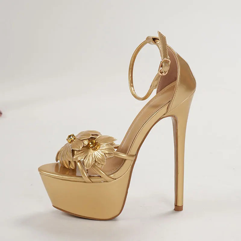 Gold high-heeled shoe with floral design