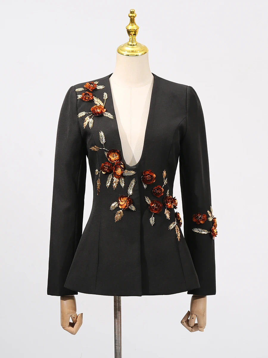 Black blazer with floral embroidery on a mannequin against a white background