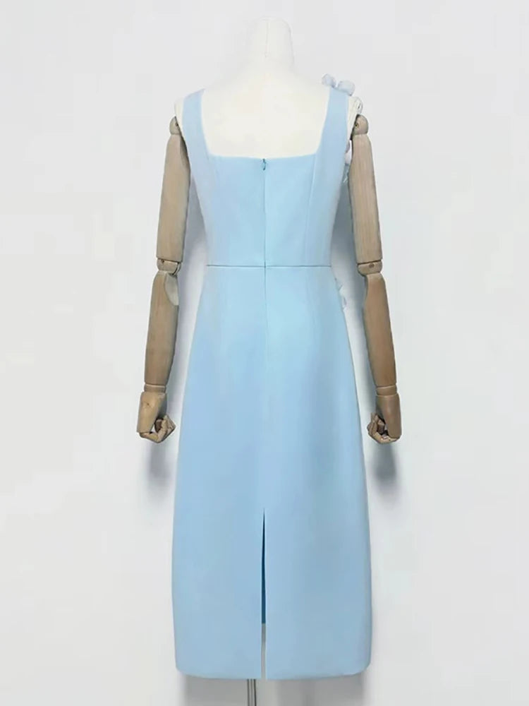 Light blue dress on a mannequin against a white background