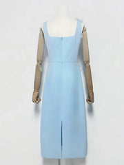 Light blue dress on a mannequin against a white background