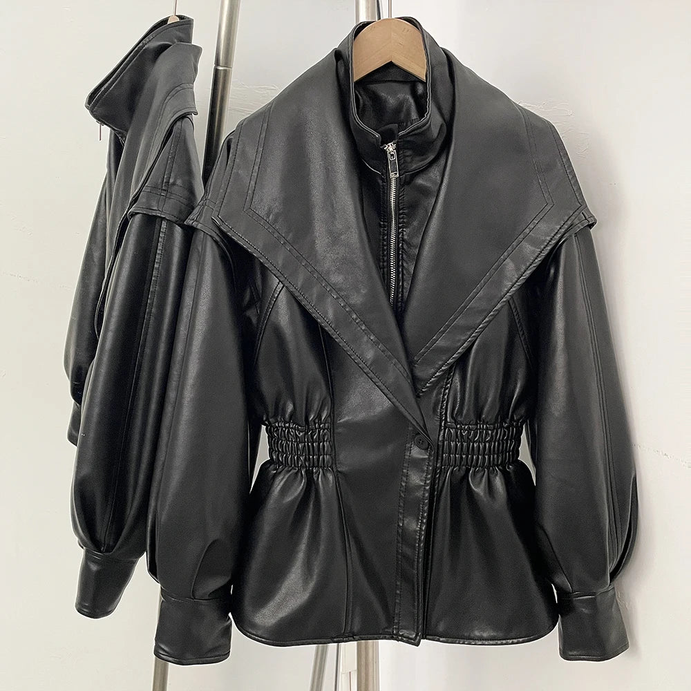 Black faux leather jacket with cinched waist and high neck detail.
