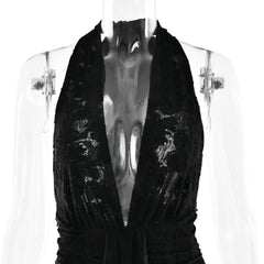 Black sequin dress on a mannequin against a white background