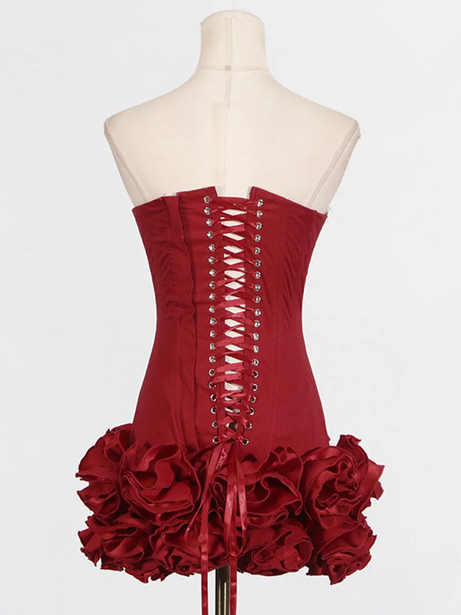 Red corset dress with ruffled skirt on a mannequin against a white background