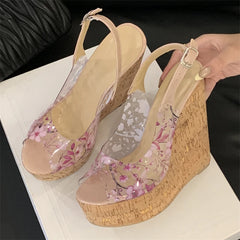 Wedge sandals with floral design on a white surface