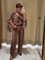 Full outfit view with deer print tie neck flare sleeve top