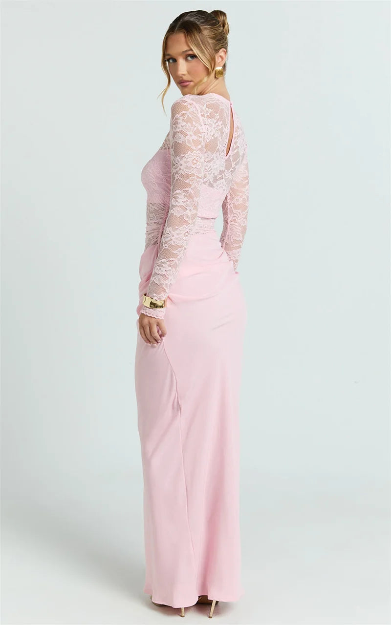 Woman wearing a pink lace dress on a white background