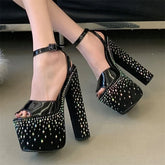 Chunky platform heels with crystal embellishments on feet