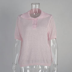 Pink short-sleeve top on a mannequin against a grey background