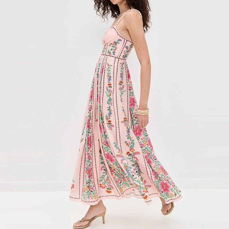 Woman wearing a pink floral dress on a white background