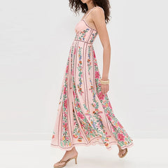 Woman wearing a pink floral dress on a white background