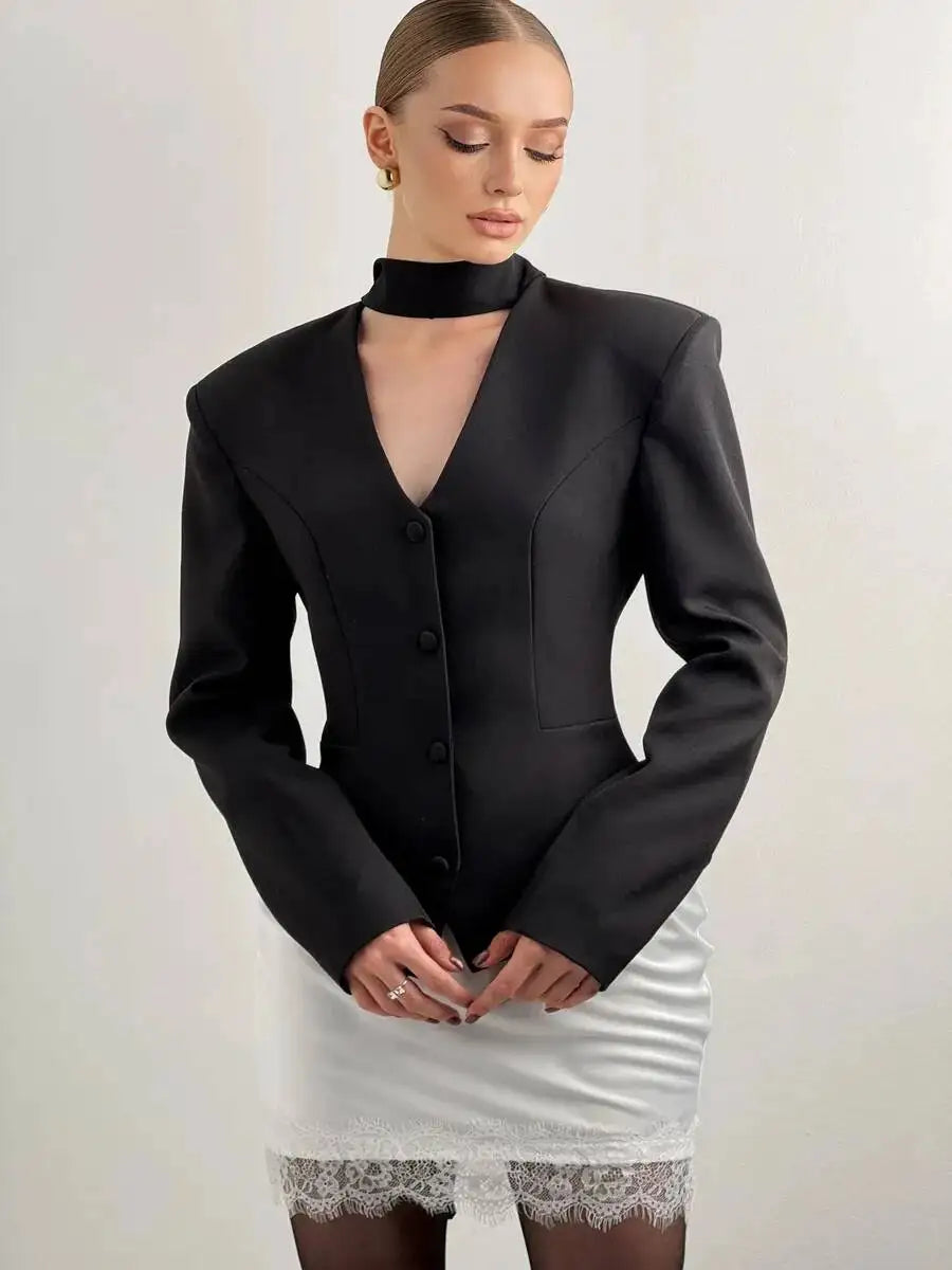 Black padded shoulder v-neck blazer with long sleeves and single-breasted buttons.
